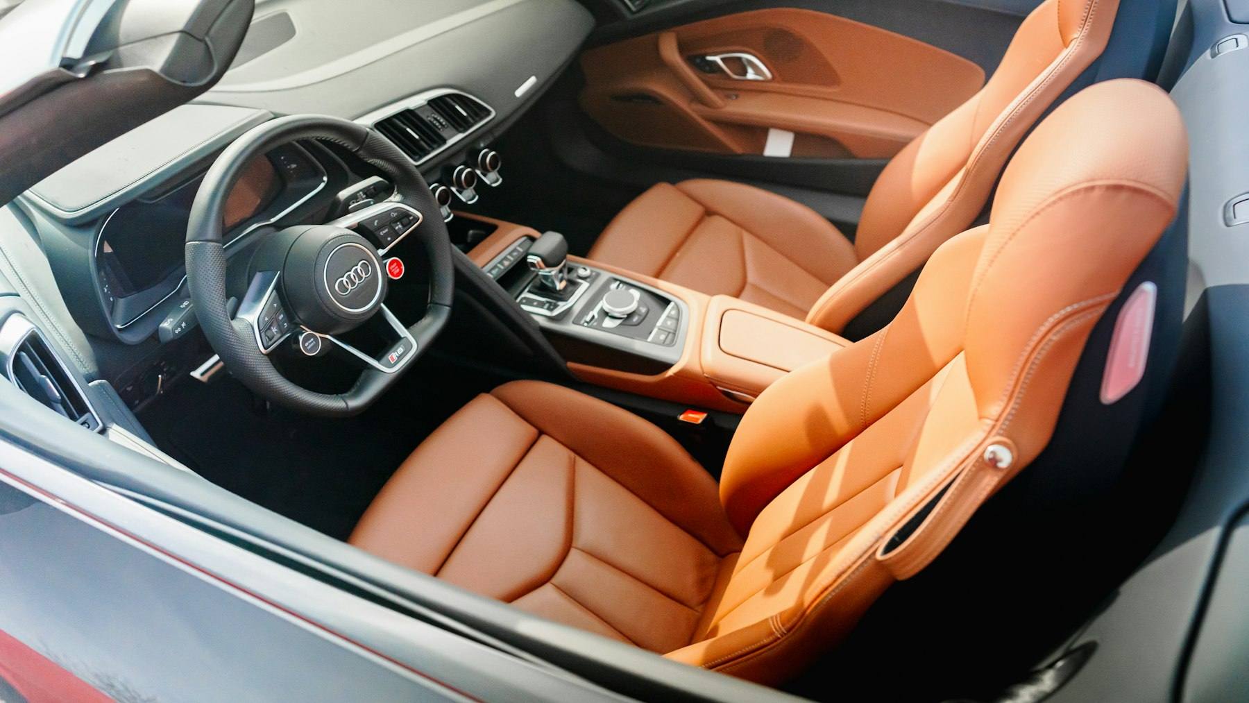 Spotless cognac leather seats inside a luxury car